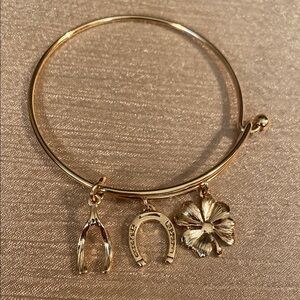 Avon Gold Tone Charm Bracelet with Wishbone, Horseshoe, and Clover